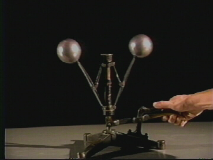 Conservation of Angular Momentum: System of Rotating Spheres